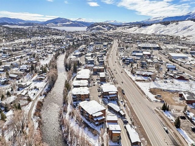 snowy aerial view with a mountain view