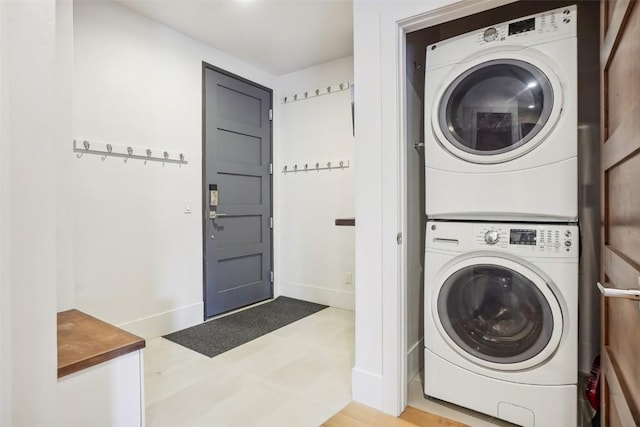 laundry room with stacked washer and dryer