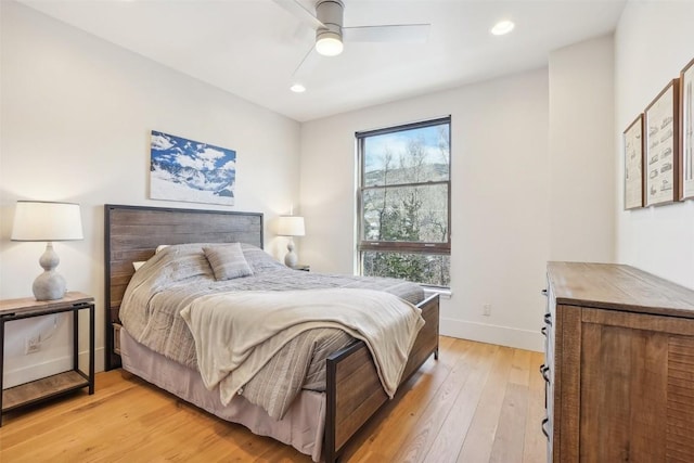 bedroom featuring ceiling fan and light hardwood / wood-style flooring