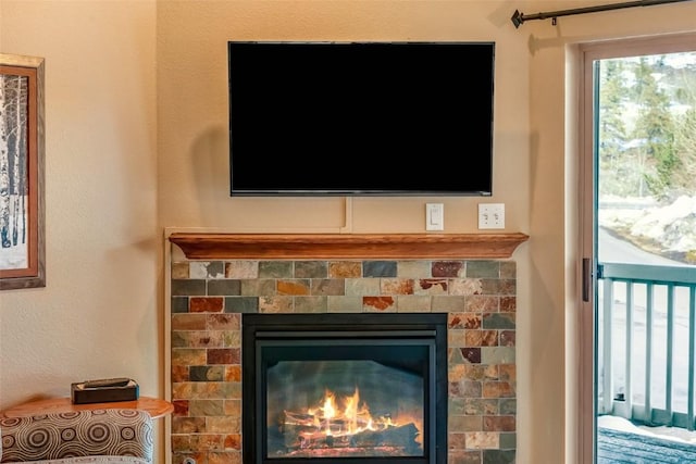 interior details featuring a glass covered fireplace