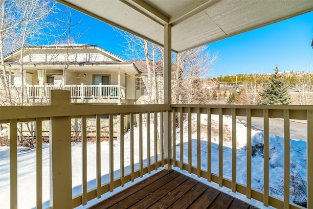 view of snow covered deck