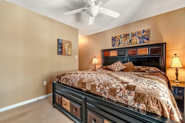 bedroom featuring light colored carpet, ceiling fan, and baseboards