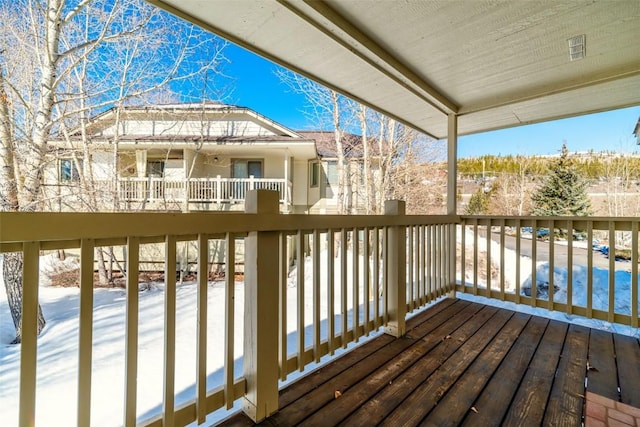 view of snow covered deck