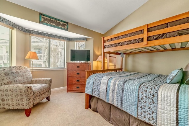 carpeted bedroom with vaulted ceiling