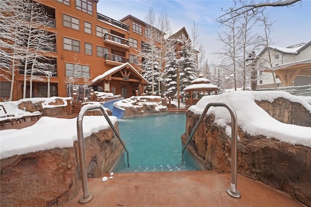 view of snow covered pool