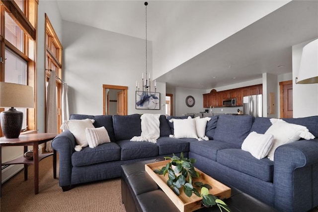 living room with light carpet and a high ceiling