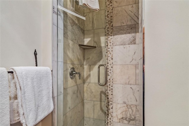 interior details featuring a stall shower