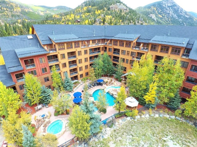 birds eye view of property with a mountain view