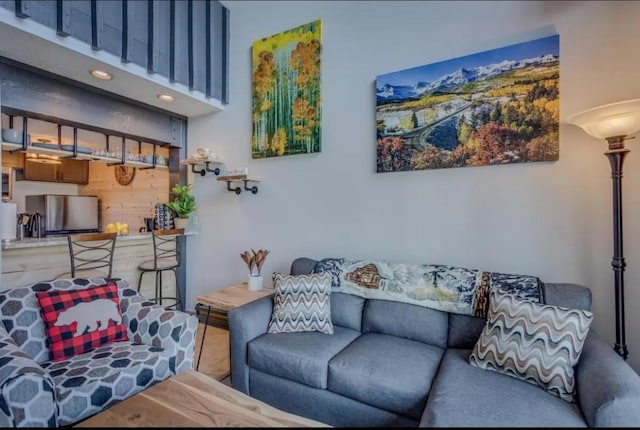 living area featuring a high ceiling