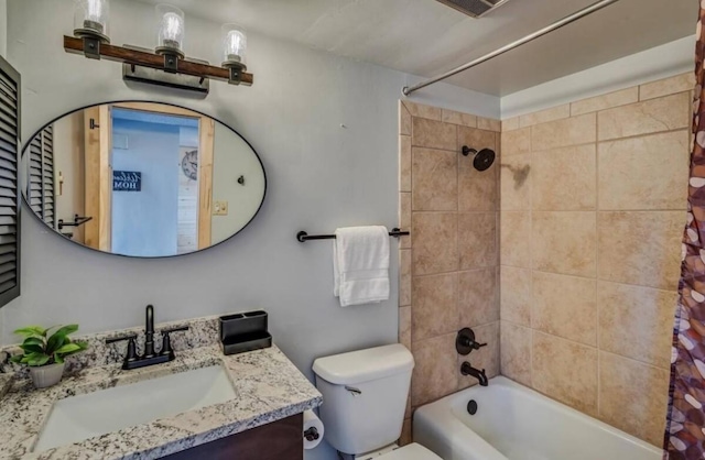 full bathroom with vanity, toilet, and shower / bath combo with shower curtain