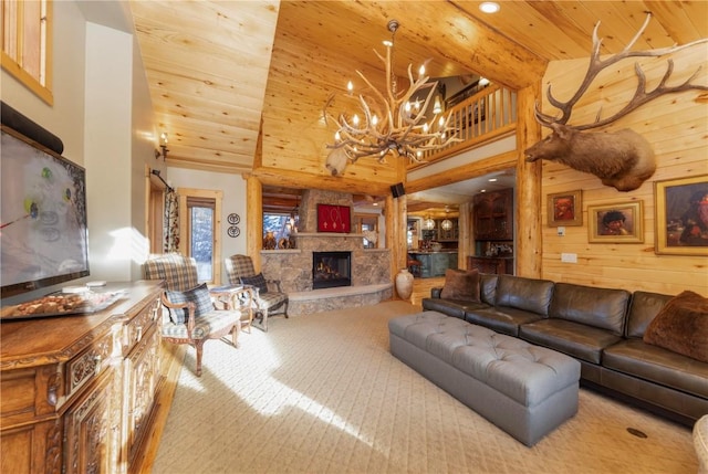 living room with wooden walls, wood ceiling, and a fireplace