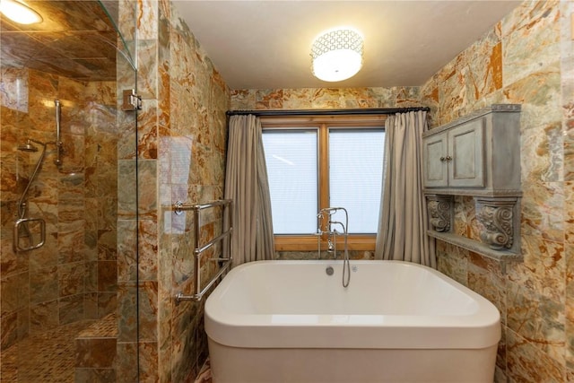 bathroom featuring plus walk in shower