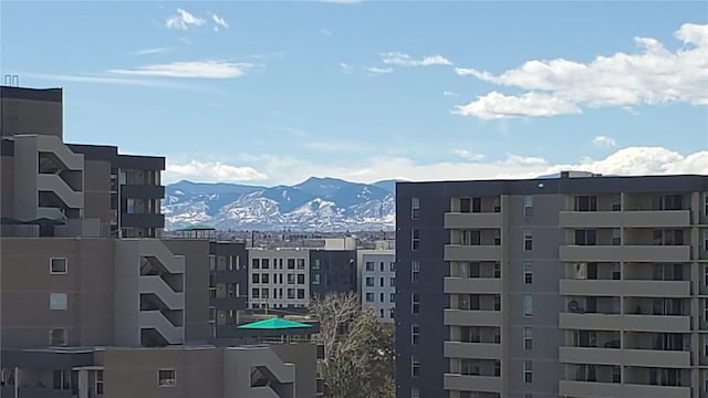 property's view of city with a mountain view