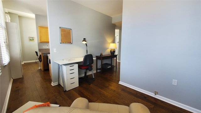 office area with dark wood finished floors and baseboards