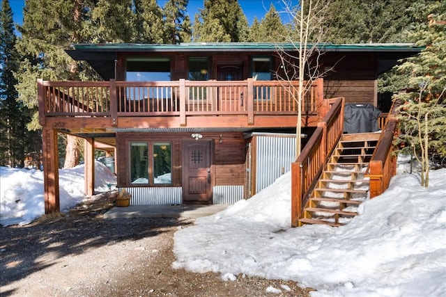 view of front of property with a wooden deck