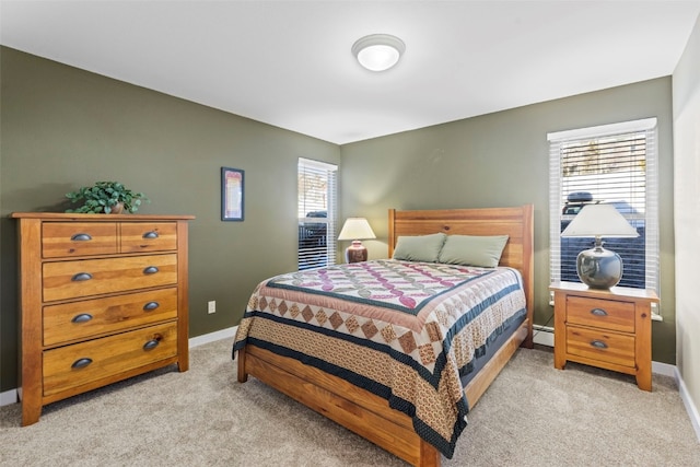 bedroom featuring a baseboard radiator, baseboards, and light colored carpet