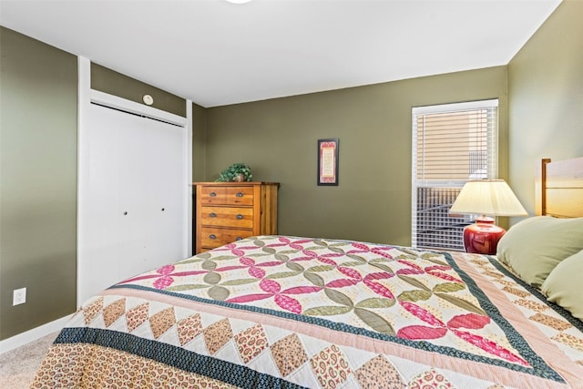 bedroom featuring carpet and a closet