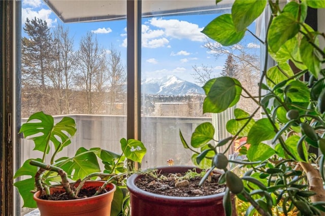 sunroom with a mountain view