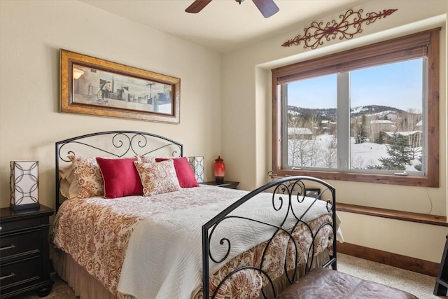 bedroom with carpet floors, a ceiling fan, and baseboards