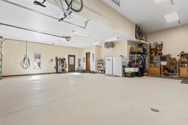 garage with freestanding refrigerator