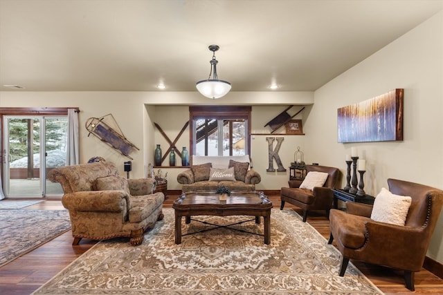 living area featuring visible vents, wood finished floors, and recessed lighting