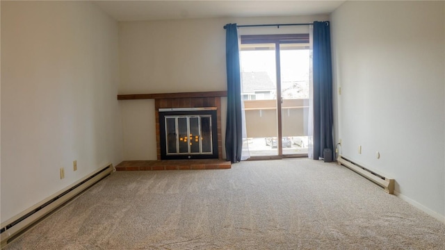 unfurnished living room featuring a brick fireplace, carpet floors, and a baseboard heating unit