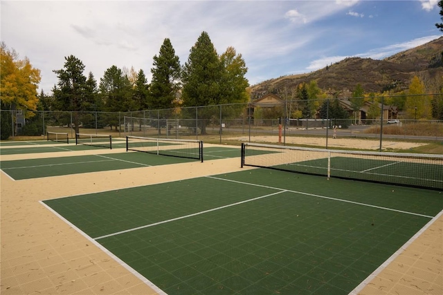 view of tennis court featuring a mountain view and basketball court