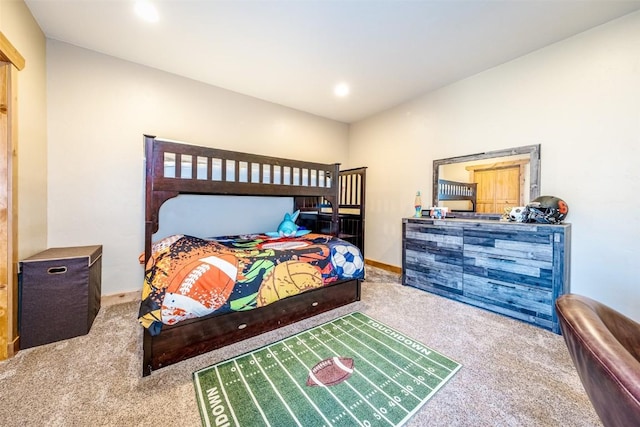 carpeted bedroom featuring recessed lighting and baseboards