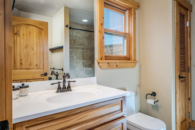 bathroom with toilet and vanity