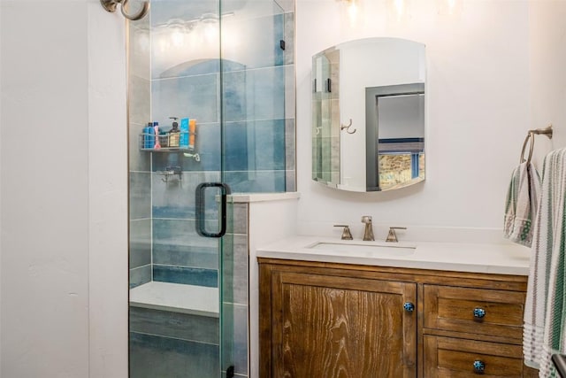 bathroom with a stall shower and vanity