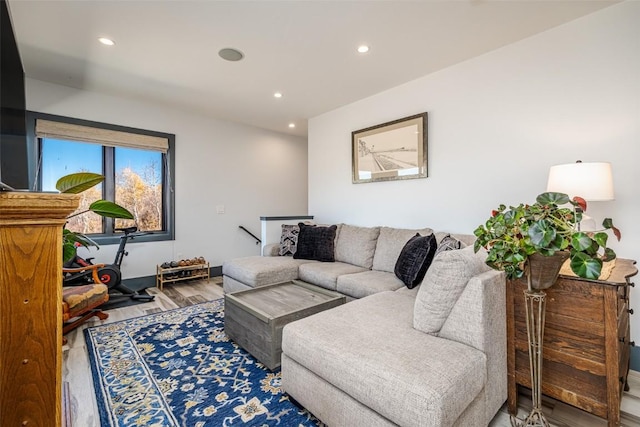 living area with recessed lighting and wood finished floors