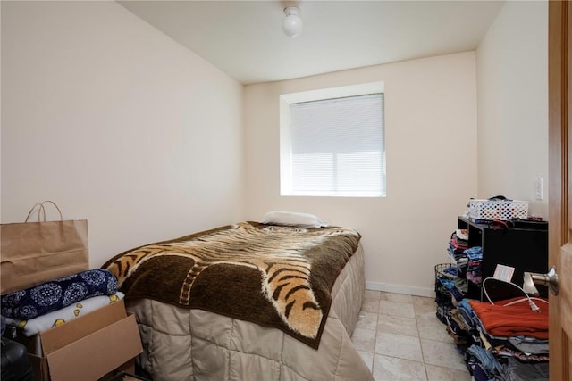 bedroom with light tile patterned floors