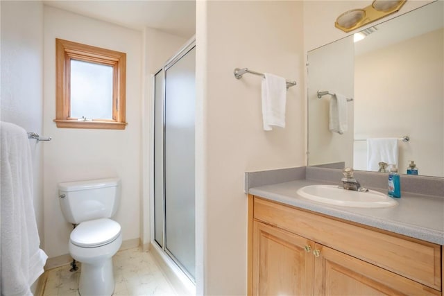 bathroom with vanity, toilet, and walk in shower