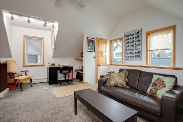 living room featuring vaulted ceiling, light colored carpet, and baseboard heating