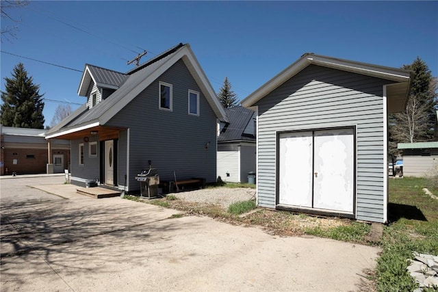 back of property with a storage unit