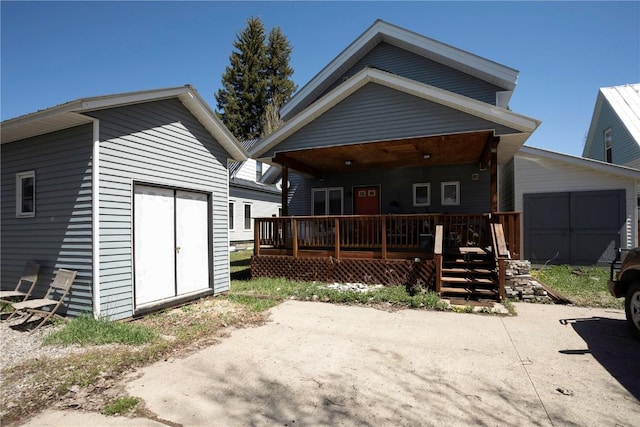 rear view of property featuring a porch