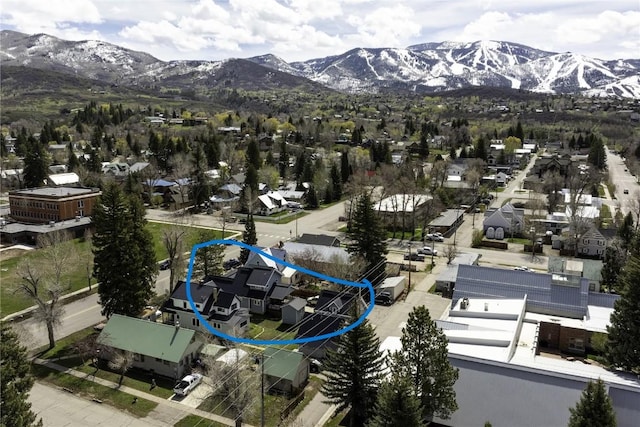 birds eye view of property with a mountain view