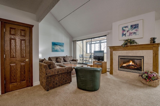 carpeted living room featuring lofted ceiling, a premium fireplace, and a textured ceiling