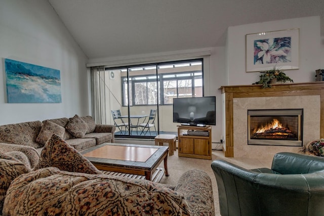 living room with a premium fireplace and vaulted ceiling