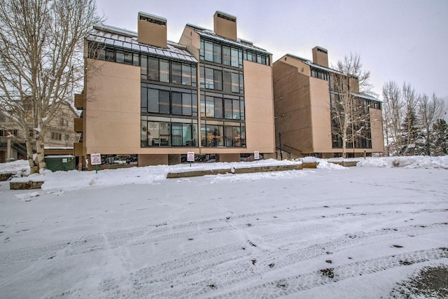 view of snow covered property