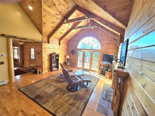 living room featuring high vaulted ceiling, wood ceiling, wooden walls, and light hardwood / wood-style floors