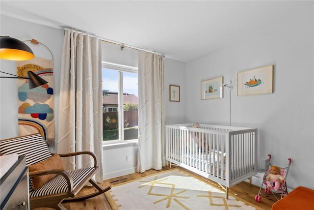 bedroom with light hardwood / wood-style floors