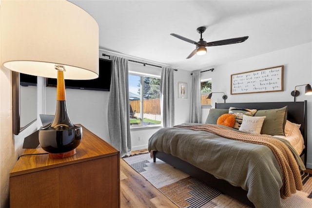 bedroom featuring ceiling fan and hardwood / wood-style floors