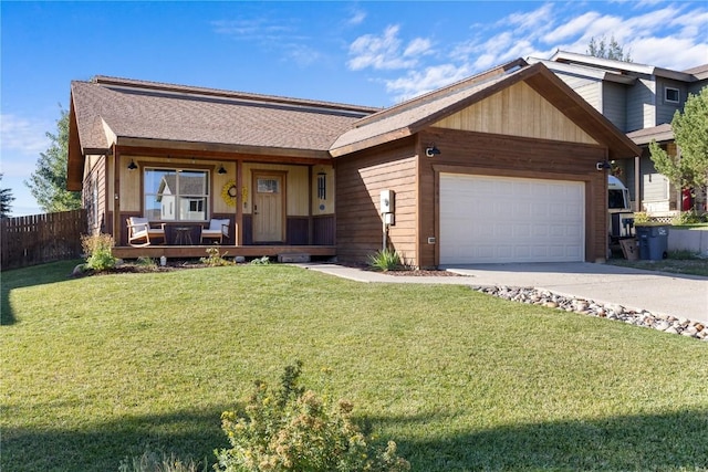 single story home with a garage and a front lawn