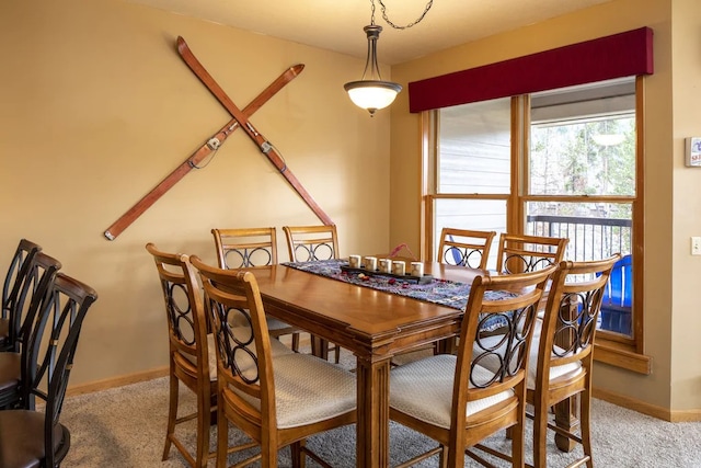 dining area with light colored carpet