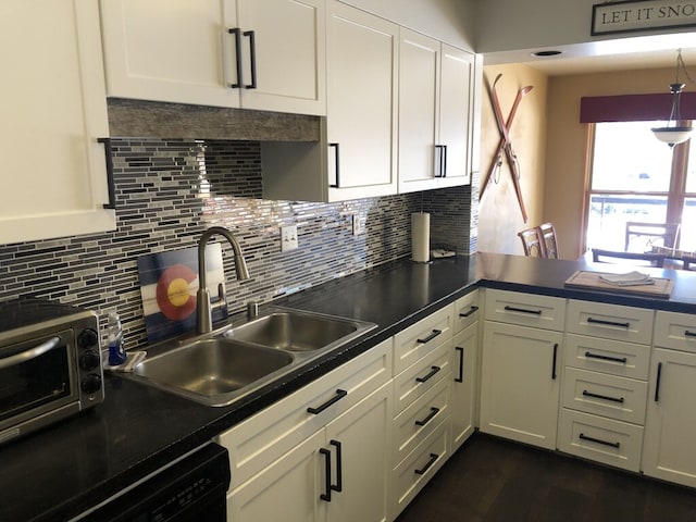 kitchen with tasteful backsplash, dishwasher, sink, and white cabinetry