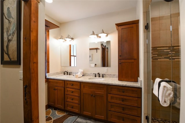 bathroom with vanity and a shower with shower door