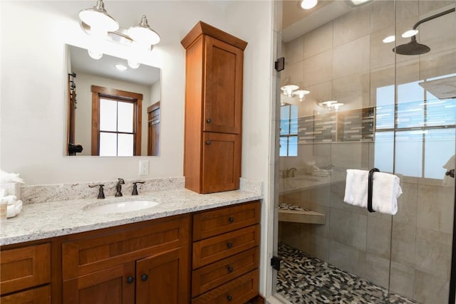 bathroom featuring vanity and walk in shower