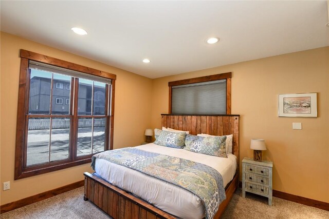 bedroom featuring light colored carpet