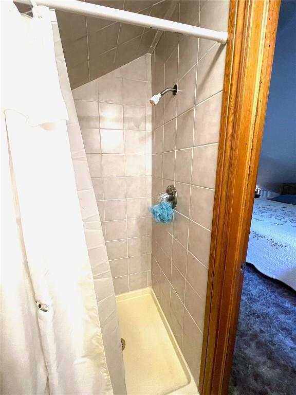 bathroom with a shower with curtain